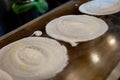 Whipping Up Dosas in a Bustling Restaurant Kitchen