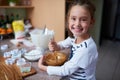 Whipping up something delicious. Portrait of a little girl baking in the kitchen.