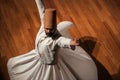 Whirling Dervish | Semazen performing Sama ritual on stage Royalty Free Stock Photo