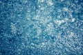 Whirling water background with bubbles and ripples in swimming pool in blue toned colors Royalty Free Stock Photo