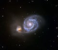 Whirlpool galaxy, colliding galaxies Royalty Free Stock Photo
