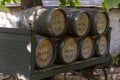 Whiskey barrels stacked on an antique wagon