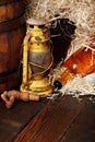 Whiskey bottles.kerosene lantern style oil lamps, wooden barrel. Still life. Copy space.