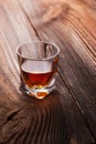 Whiskey, bourbon, brandy, or cognac on log table Royalty Free Stock Photo