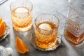 Whiskey, brandy or bourbon alcohol drink in crystal glasses