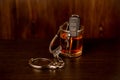 Whiskey with car keys and handcuffs. Concept for drinking and driving Royalty Free Stock Photo