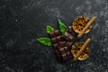 Whiskey, chocolate and cigars on a black stone table. Top view. Royalty Free Stock Photo