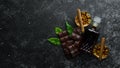 Whiskey, chocolate and cigars on a black stone table. Top view. Royalty Free Stock Photo