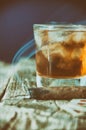 Whiskey, cigar and cards on a wooden background Royalty Free Stock Photo