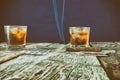 Whiskey, cigar and cards on a wooden background Royalty Free Stock Photo