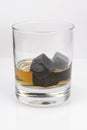 Whiskey cooling stone cubes and glass with whiskey