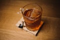 Whiskey drink with ice on wood in bar Royalty Free Stock Photo