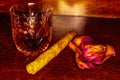 Whiskey drinks with cigars on wooden