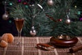 Whiskey glass, ashtray and cigar on the Christmas table.