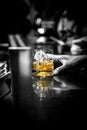 Whiskey glass on bar counter.