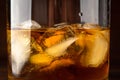 Whiskey in glass with cubes of ice, close up macro photo Royalty Free Stock Photo