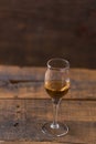 whiskey in glass on wood background