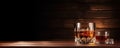 Whiskey glass on wooden table with luxury cigar. Alcohol cognac and cubanian cigar Royalty Free Stock Photo