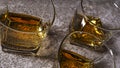 Whiskey in glasses on a gray stone background, top view Royalty Free Stock Photo