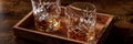 Whiskey in glasses with ice panorama. Bourbon whisky on rocks on a dark table Royalty Free Stock Photo