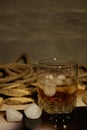 Whiskey with ice on a light background Royalty Free Stock Photo