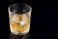 Whiskey with ice in rocks glass on black background with clipping path Royalty Free Stock Photo