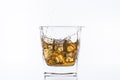 Whiskey with ice. Rum with ice. Brown brandy with ice. Three ice cubes in a glass with alcohol. Royalty Free Stock Photo