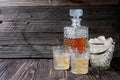 Whiskey or Scotch from carafe into a glass with ice cubes Royalty Free Stock Photo