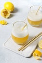 Whiskey sour cocktail - bourbon with lemon juice, sugar syrup and egg white in glass. Vertical orientation Royalty Free Stock Photo