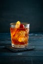 Whiskey sour cocktail with a slice of orange, cherry and ice Royalty Free Stock Photo