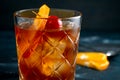 Whiskey sour cocktail with a slice of orange, cherry and ice, a classic alcoholic drink Royalty Free Stock Photo