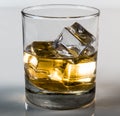 Whiskey in glass with ice cubes with white background Royalty Free Stock Photo