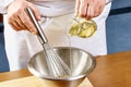 Whisking vigorously to disperse oil Making Mayonnaise oil Royalty Free Stock Photo