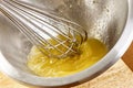 Whisking vigorously to disperse oil Making Mayonnaise oil Royalty Free Stock Photo