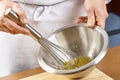 Whisking vigorously to disperse oil Making Mayonnaise oil Royalty Free Stock Photo