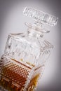 Whisky in beautiful glass bottle, rum, bourbon, cognac, brandy, glassware Royalty Free Stock Photo