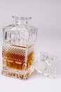 Whisky in beautiful glass bottle, rum, bourbon, cognac, brandy, glassware Royalty Free Stock Photo