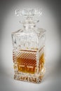 Whisky in beautiful glass bottle, rum, bourbon, cognac, brandy, glassware Royalty Free Stock Photo