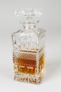 Whisky in beautiful glass bottle, rum, bourbon, cognac, brandy, glassware Royalty Free Stock Photo