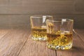 Whisky with ice in two glasses on a wooden background. Copy space. Food background. Toning Royalty Free Stock Photo