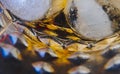 A close-up of a glass filled with whiskey