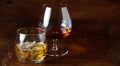 Whisky on the rocks and cognac in a snifter