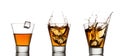 Whisky splash in glass isolated on a white Royalty Free Stock Photo