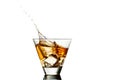 Whisky splash in glass isolated on a white background Royalty Free Stock Photo