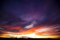 A Sunset Over the Plains of Whispy Clouds Royalty Free Stock Photo