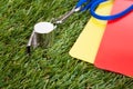 Whistle With Red And Yellow Card On The Field