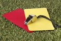 Whistle With Red And Yellow Card On The Field Royalty Free Stock Photo