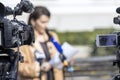 Whistleblower holding confidential document and giving a statement in front of television video camera at press conference or news Royalty Free Stock Photo