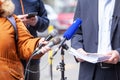 Whistleblower holding document and giving statement at media event or news conference Royalty Free Stock Photo