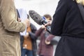 Whistleblower holding document and giving statement at media event or news conference